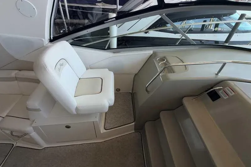 Slide: The Image of Interior of 2011 Sea Ray Sundancer 370 yacht with white seating and steps. - 14