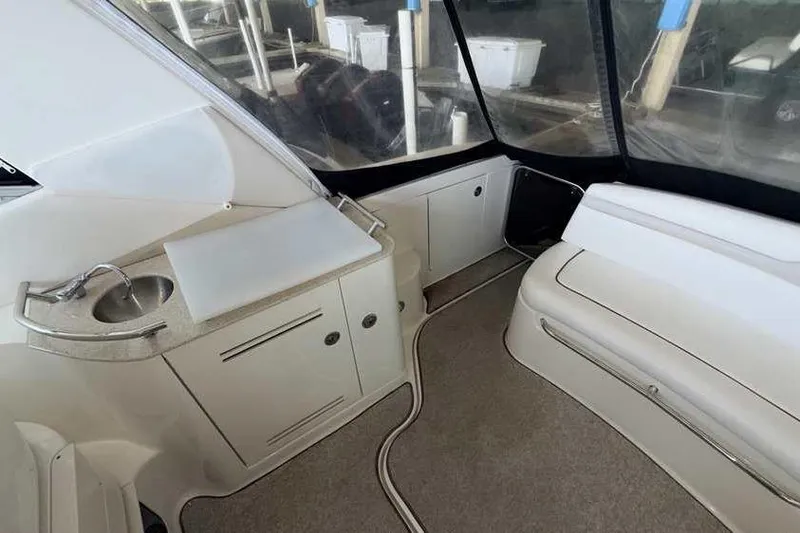 Slide: The Image of Interior of 2011 Sea Ray Sundancer 370 yacht with sink and seating area. - 8
