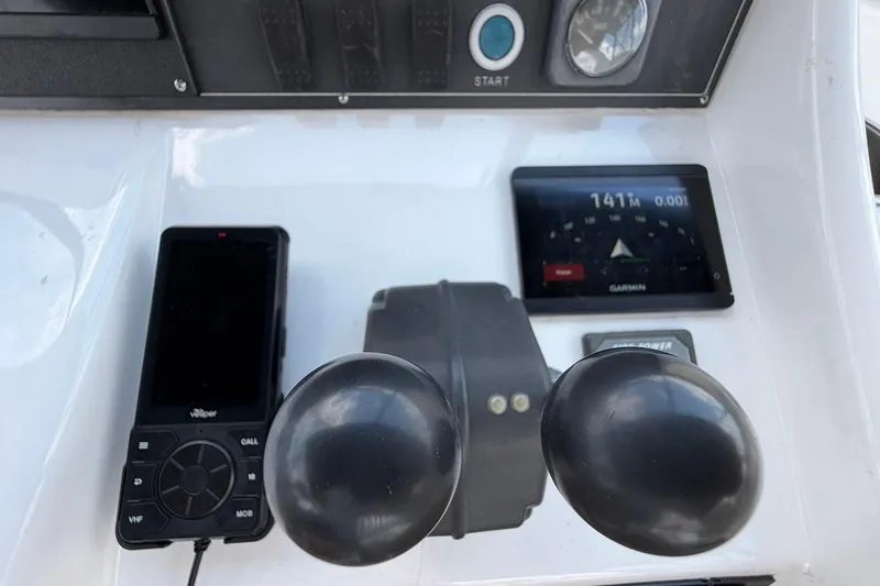 Slide: The Image of Control panel of 2005 Ocean Alexander 48 Altus with Garmin display and Vesper device. - 67