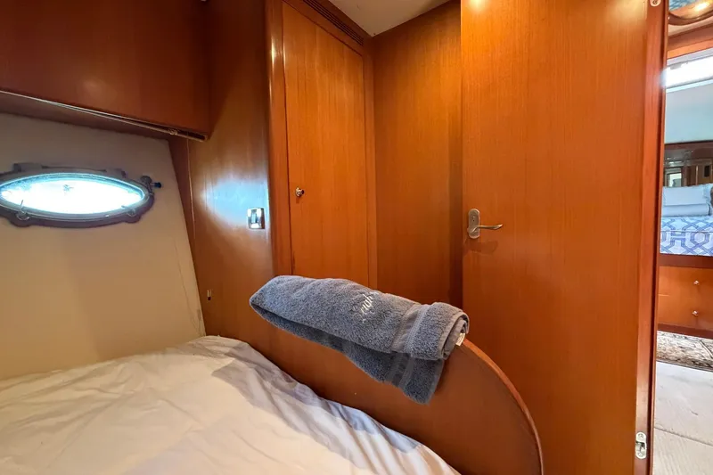 Slide: The Image of Cozy cabin interior of 2005 Ocean Alexander 48 Altus yacht with wooden paneling. - 60