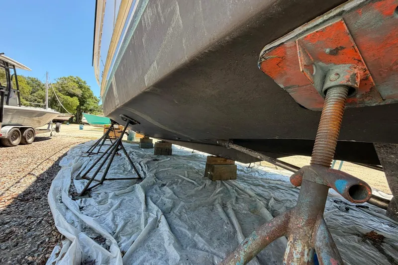 Slide: The Image of 2005 Ocean Alexander 48 Altus yacht on stands for maintenance, underbody view. - 96
