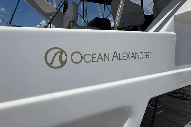 Slide: The Image of Ocean Alexander 48 Altus 2005 yacht logo on white hull, sunny day. - 11