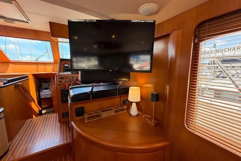 Slide: The Image of Luxurious interior of 2005 Ocean Alexander 48 Altus yacht with TV and wooden finishes. - 42
