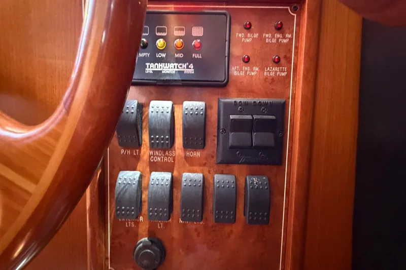 Slide: The Image of Control panel of a 2005 Ocean Alexander 48 Altus yacht, featuring switches and indicators. - 74