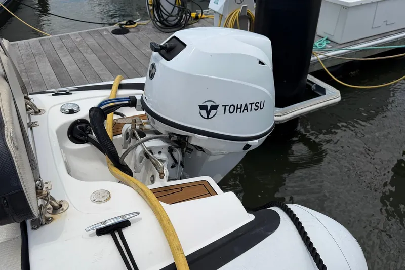 Slide: The Image of Tohatsu outboard motor on 2005 Ocean Alexander 48 Altus yacht at dock. - 100