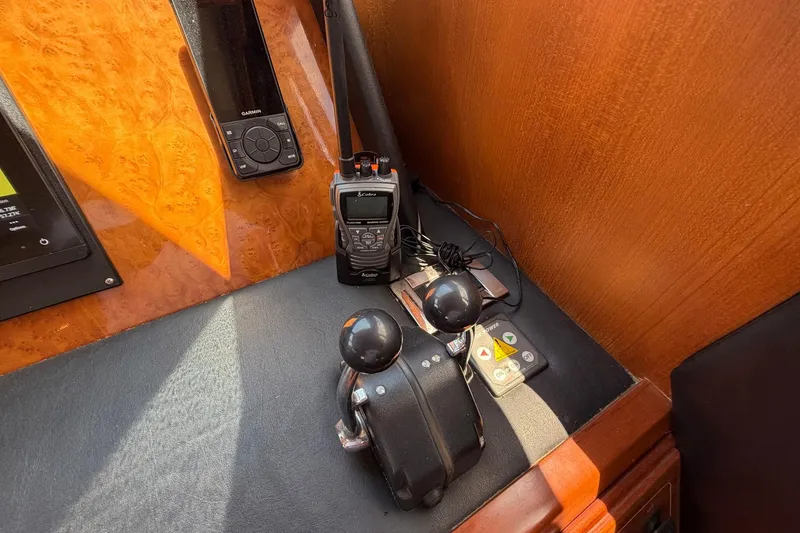 Slide: The Image of Control panel of 2005 Ocean Alexander 48 Altus yacht with radio and navigation equipment. - 73