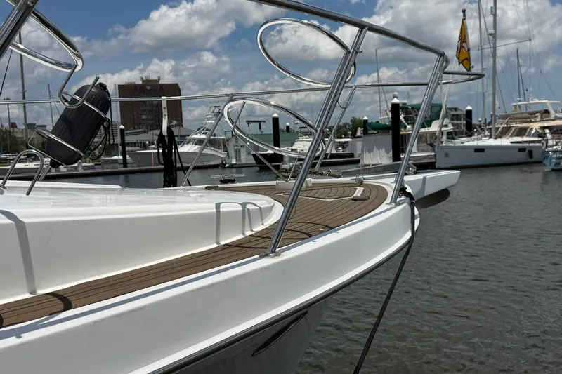 Slide: The Image of 2005 Ocean Alexander 48 Altus yacht docked at marina under blue sky. - 13