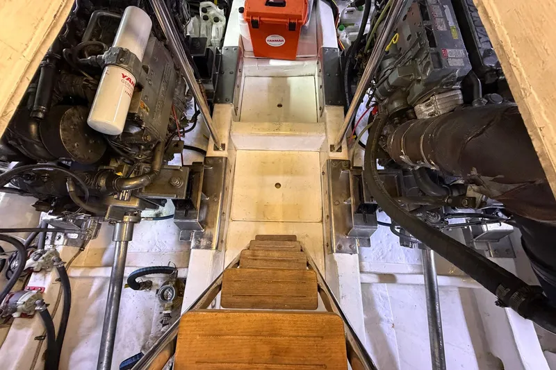 Slide: The Image of Engine room of 2005 Ocean Alexander 48 Altus yacht, showcasing mechanical components and equipment. - 81