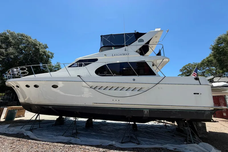 Slide: The Image of 2005 Ocean Alexander 48 Altus yacht on dry dock under clear blue sky. - 93