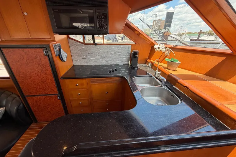 Slide: The Image of Luxurious kitchen interior of 2005 Ocean Alexander 48 Altus yacht with modern amenities. - 45