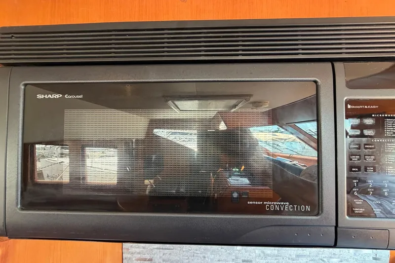 Slide: The Image of Sharp Carousel convection microwave in 2005 Ocean Alexander 48 Altus yacht kitchen. - 47