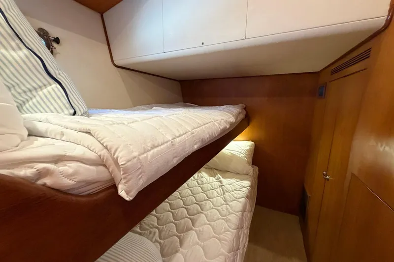 Slide: The Image of Bunk beds in 2005 Ocean Alexander 48 Altus yacht cabin with wood paneling. - 61