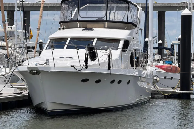 Slide: The Image of 2005 Ocean Alexander 48 Altus yacht docked at marina, front view. - 3