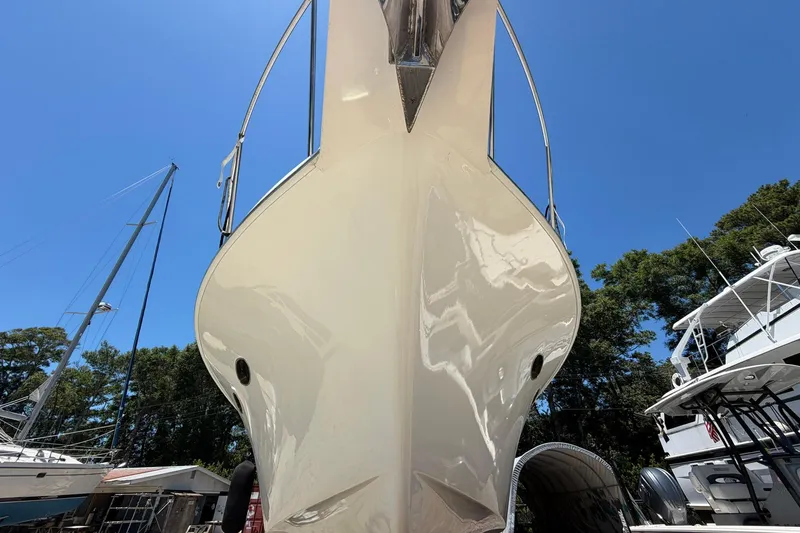 Slide: The Image of Front view of 2005 Ocean Alexander 48 Altus yacht under clear blue sky. - 97