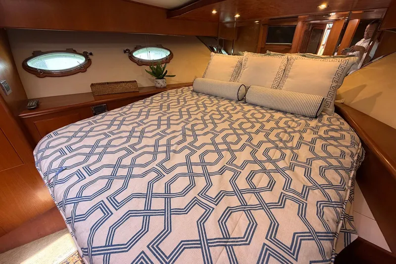 Slide: The Image of Luxurious cabin interior of 2005 Ocean Alexander 48 Altus yacht with patterned bedding. - 55