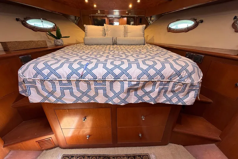 Slide: The Image of Luxurious cabin interior of 2005 Ocean Alexander 48 Altus yacht with elegant bedding. - 53