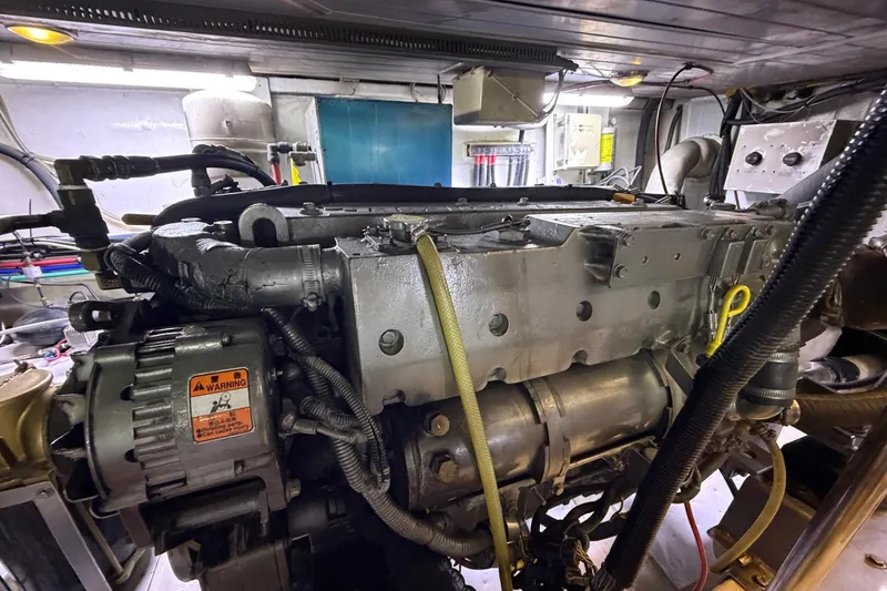 Slide: The Image of Engine room of 2005 Ocean Alexander 48 Altus yacht, showcasing detailed machinery. - 83