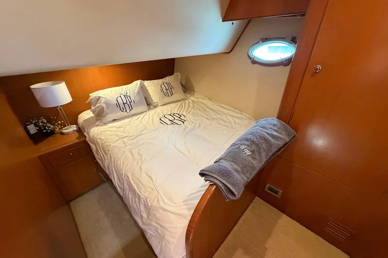 Slide: The Image of Luxurious cabin interior of 2005 Ocean Alexander 48 Altus yacht with cozy bedding. - 58
