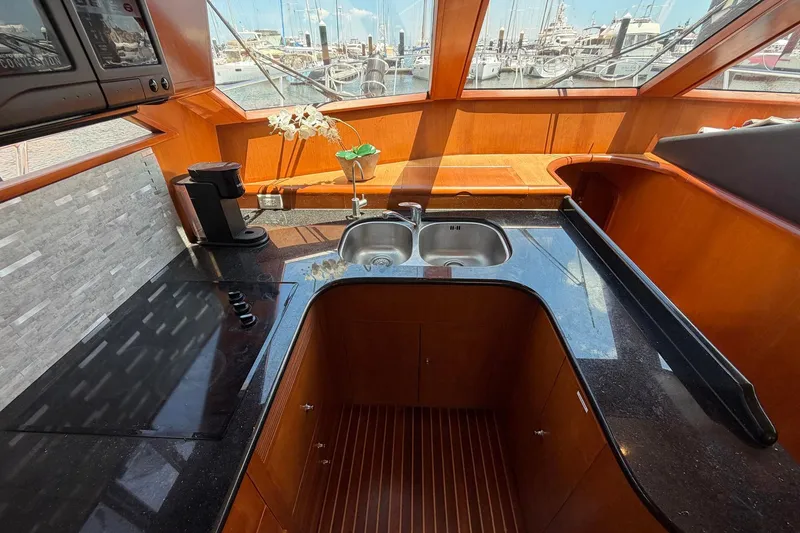 Slide: The Image of Luxurious 2005 Ocean Alexander 48 Altus yacht kitchen with sleek countertops and modern appliances. - 44