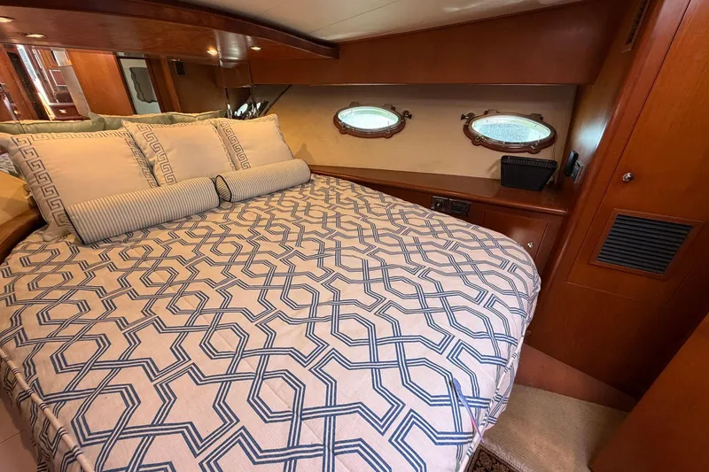 Slide: The Image of Luxurious cabin interior of 2005 Ocean Alexander 48 Altus yacht with elegant bedding. - 54