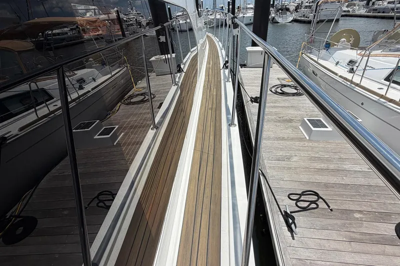 Slide: The Image of Side deck of 2005 Ocean Alexander 48 Altus yacht docked at marina. - 12