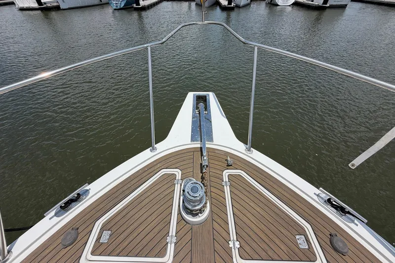 Slide: The Image of Bow view of 2005 Ocean Alexander 48 Altus yacht at marina. - 14