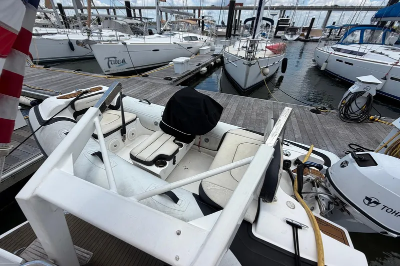 Slide: The Image of 2005 Ocean Alexander 48 Altus yacht docked at marina with other boats. - 99