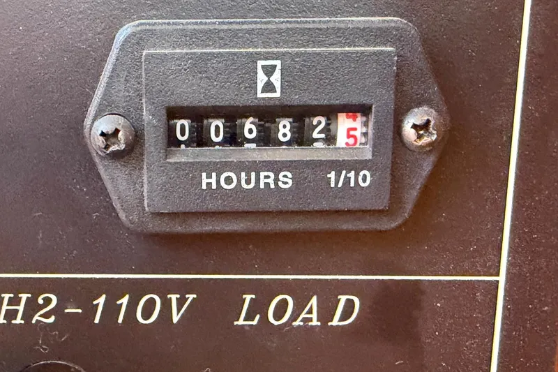 Slide: The Image of Hour meter showing 682.5 hours on a 2005 Ocean Alexander 48 Altus. - 80