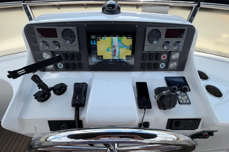 Slide: The Image of Helm of 2005 Ocean Alexander 48 Altus yacht with navigation controls and display. - 36