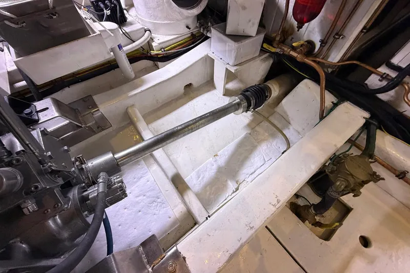 Slide: The Image of Engine room of 2005 Ocean Alexander 48 Altus yacht, showcasing mechanical components. - 85