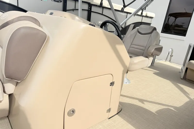 Slide: The Image of 2017 Harris Super Sunliner 200 boat interior with beige seating and steering console. - 11