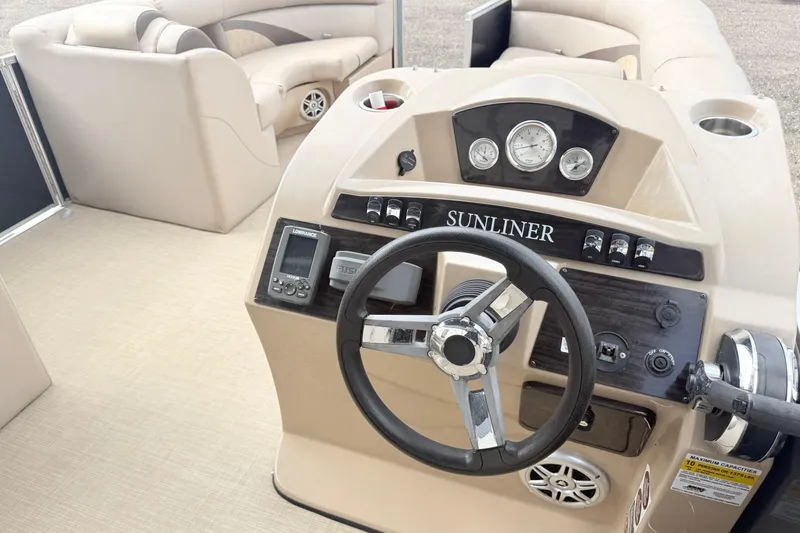 Slide: The Image of Interior view of 2017 Harris Super Sunliner 200 boat with steering console and seating. - 8