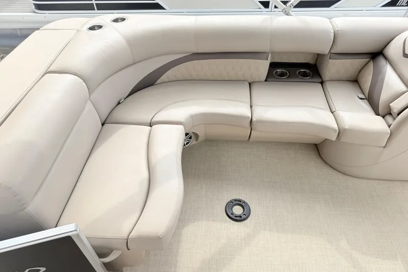 Slide: The Image of Luxurious seating on a 2017 Harris Super Sunliner 200 pontoon boat with cup holders. - 13
