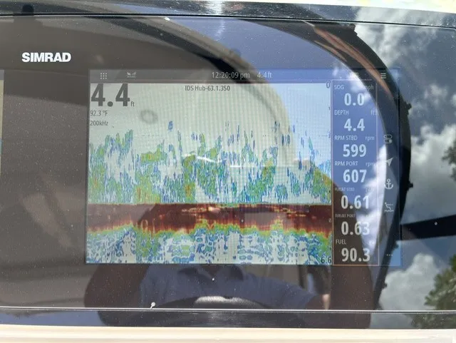 Slide: The Image of A Simrad display shows sonar data with depth and speed information on a boat. - 21