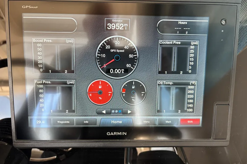 Slide: The Image of Garmin GPS display on 2012 Pursuit OS 345 Offshore boat showing various engine metrics. - 7