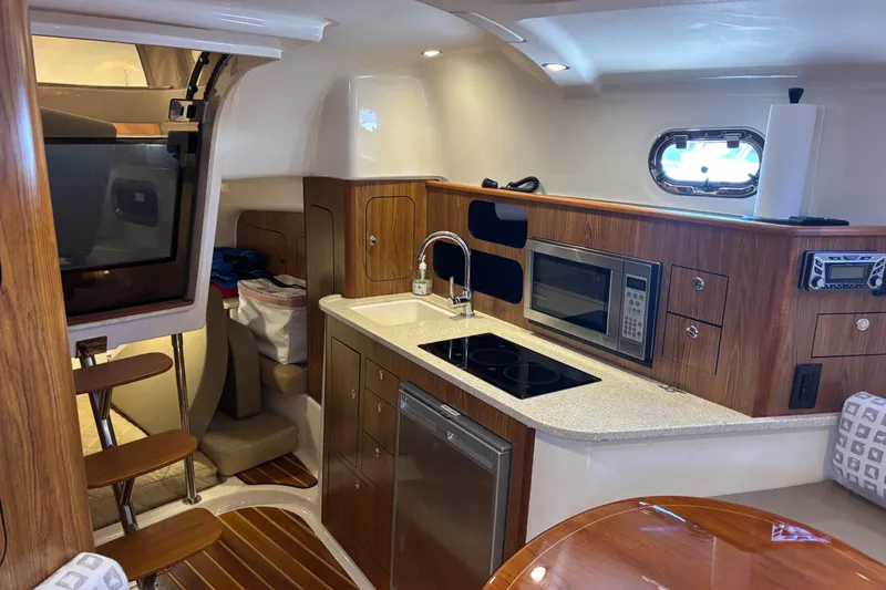 Slide: The Image of 2012 Pursuit 345 OS Cabin/Galley - 44