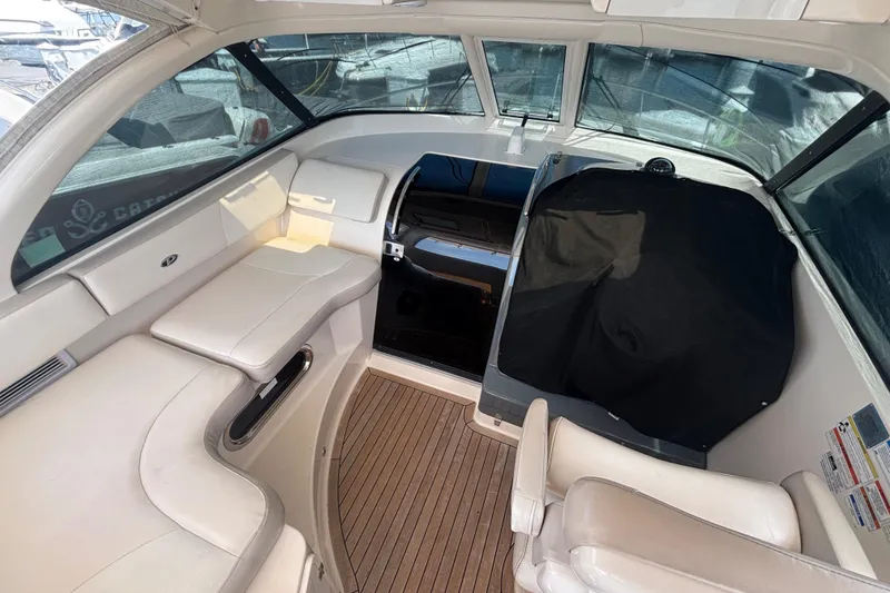Slide: The Image of Interior of a 2012 Pursuit OS 345 Offshore boat with seating and helm area. - 14