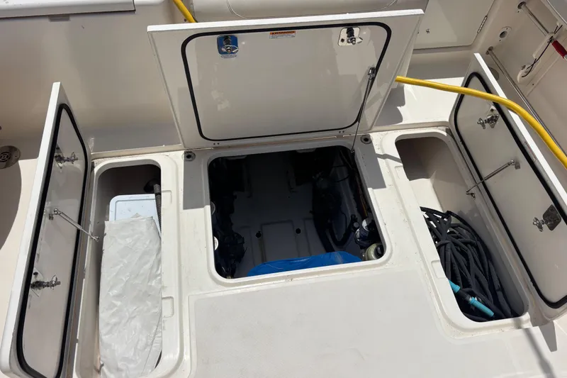 Slide: The Image of 2012 Pursuit 345 Offshore fish/storage boxes in cockpit sole and Centerline Mechanical Compartment/Bilge Access - 18