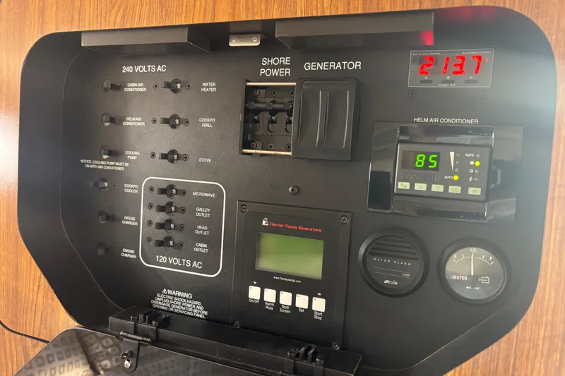 Slide: The Image of 2012 Pursuit 345 OS Electrical Panel in Cabin - 32