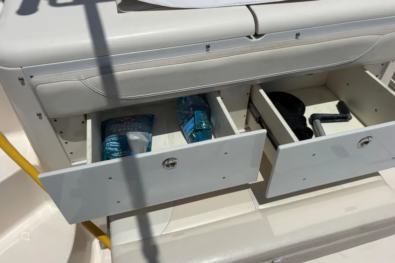Slide: The Image of 2012 Pursuit 345 OS Storage/Tackle drawers in aft console - 22