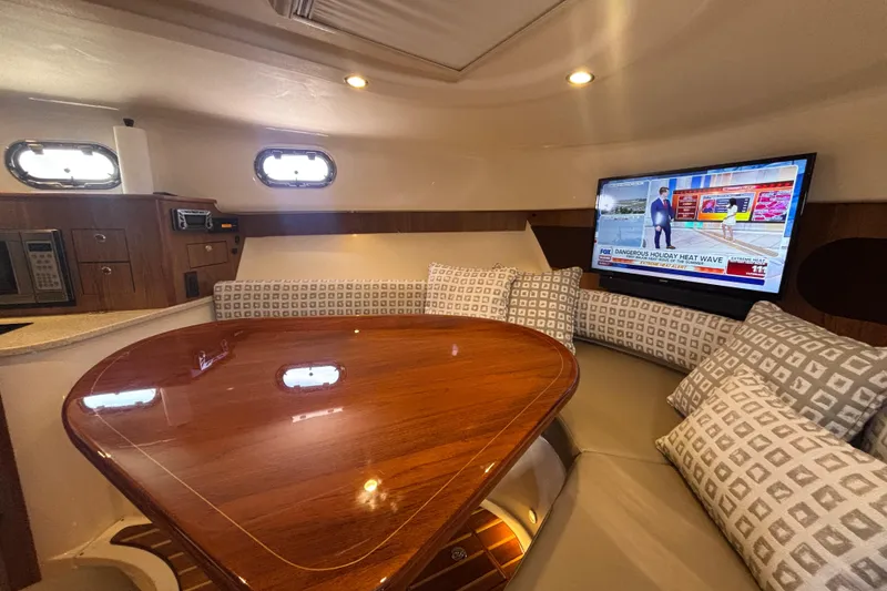 Slide: The Image of 2012 Pursuit 345 OS Forward settee/cherrywood table/Flatscreen TV/Port Lights - 40