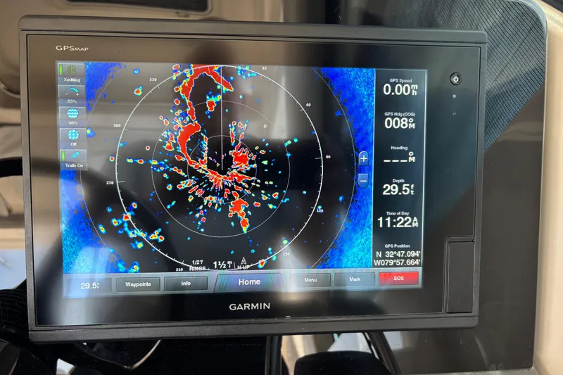Slide: The Image of Garmin GPS display on 2012 Pursuit OS 345 Offshore boat, showing radar and navigation data. - 6
