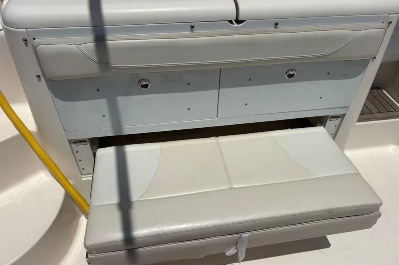 Slide: The Image of 2012 Pursuit 345 OS Hide-away Seat that faces aft - 21