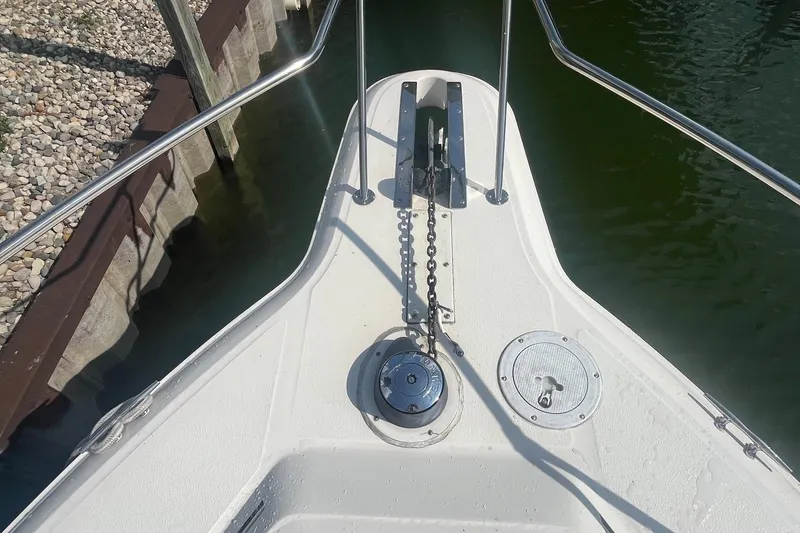 Slide: The Image of Bow of 1994 Sea Ray 330 Express Cruiser with anchor chain and deck fittings. - 3