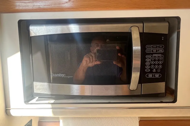 Slide: The Image of Built-in microwave on a 1994 Sea Ray 330 Express Cruiser yacht kitchen. - 26