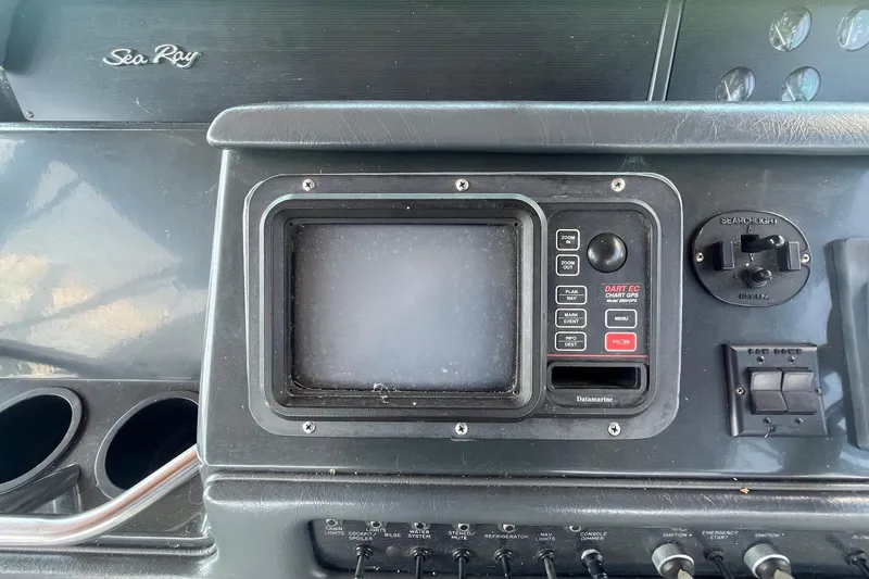 Slide: The Image of Control panel of a 1993 Sea Ray Sundancer 330 boat with navigation equipment. - 10