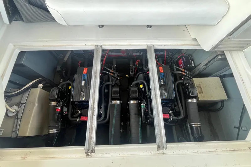 Slide: The Image of Engine compartment of a 1993 Sea Ray Sundancer 330, showcasing dual engines and components. - 24