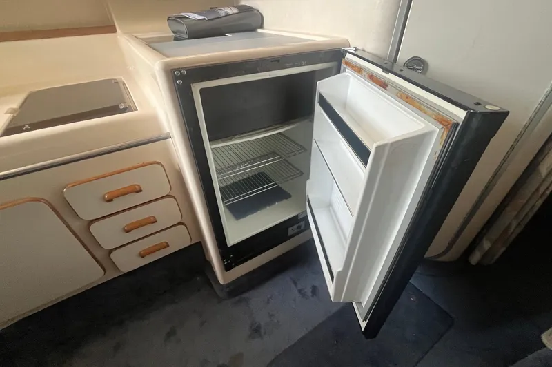 Slide: The Image of Open refrigerator in 1993 Sea Ray Sundancer 330 yacht interior kitchen area. - 19
