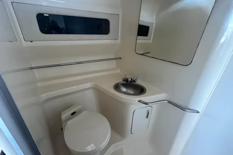 Slide: The Image of Bathroom interior of 1993 Sea Ray Sundancer 330 yacht, featuring sink and toilet. - 20