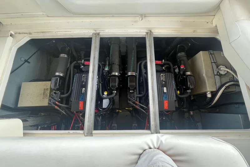 Slide: The Image of Engine compartment of a 1993 Sea Ray Sundancer 330, showcasing dual engines and components. - 23